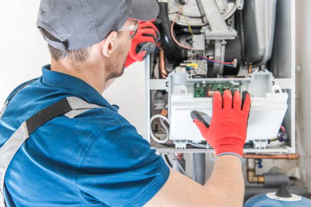 An Eco Temp HVAC technician performing annual maintenance on Residential Heating Equipment.