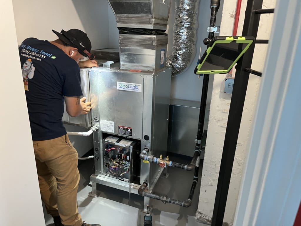 Technician working on furnace.